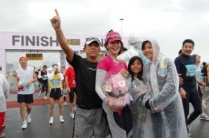 my girls in raincoats at the finish