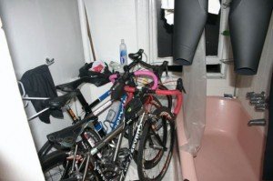 bikes Bikes and wetsuits and everything else parked in the bathroom
